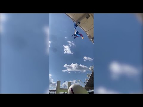 ラグビーの試合球届けるためパラシュートで降下中、スタジアムの屋根に宙づり　フランス